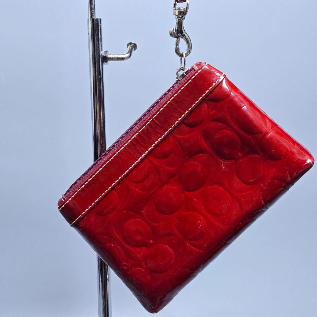 Red Coach Patent Leather Wristlet (Category: Purses & Pouches) located in Baguio. Submitted by shoppestylish (Listing ID 1463940209, Image 3). Description: Dimensions: W: 7.5 L: 5 ​Condition: Pre-loved with light signs of wear..