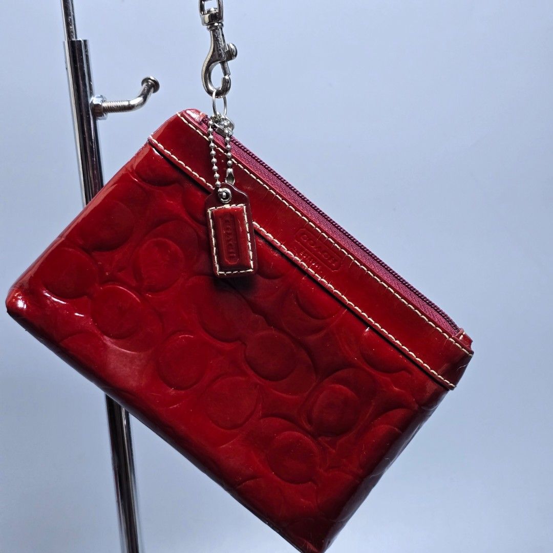 Red Coach Patent Leather Wristlet (Category: Purses & Pouches) located in Baguio. Submitted by shoppestylish (Listing ID 1463940209, Image 2). Description: Dimensions: W: 7.5 L: 5 ​Condition: Pre-loved with light signs of wear..