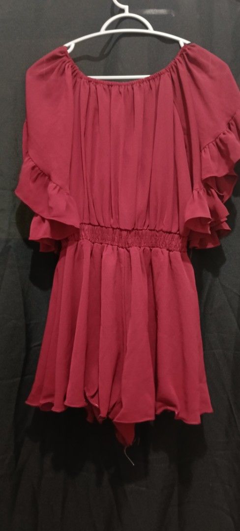 Red Off-Shoulder Romper with Ruffle Sleeves (Category: Rompers) located in Manila. Submitted by limon3s (Listing ID 1463997520, Image 1). Description: - Cute red off-shoulder romper shorts - Elasticated waist for a flattering fit - Adorable ruffle sleeves - Flowy and lightweight fabric - Versatile for casual or night out.