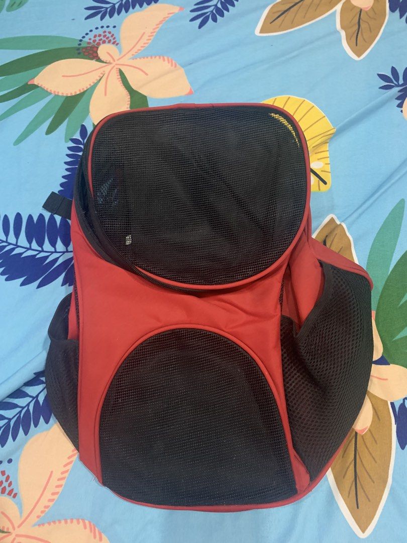 Red Pet Carrier Backpack with Mesh Panels (Category: Backpacks) located in Malabon City. Submitted by ena.gregorio (Listing ID 1463958638, Image 1). Description: - Red pet carrier backpack - Mesh panels on front and sides for excellent ventilation - Padded straps for maximum comfort during travel - Convenient side pocket for storing essentials - Smooth-working zippers for easy access - Clean inside and out, ready for your next adventure.