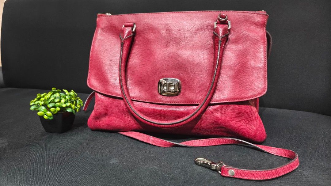 Red Textured Handbag with Silver Hardware (Category: Tote Bags) located in Davao. Submitted by _jetnest25 (Listing ID 1464010317, Image 1). Description: - Chic red textured handbag - Secure flap closure with silver buckle - Comfortable top handles - Includes a detachable shoulder strap for versatility - Ample interior space for your essentials - Ideal for everyday wear or a night out.