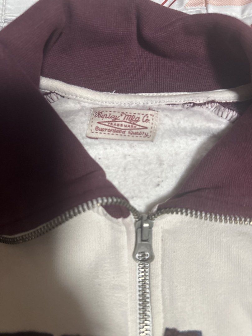 Replay Zip-Up Jacket (Category: Coats, Jackets and Outerwear) located in Pasig City. Submitted by s4sayaki (Listing ID 1464060213, Image 2). Description: - Replay Mfg Co. jacket - Stylish burgundy and cream color block design - Features embroidered 'REPLAY' text on the front - Includes a '16' graphic on the side - Zip-up closure with a classic collar - Long sleeves for comfortable wear - Perfect for casual outings and everyday style.