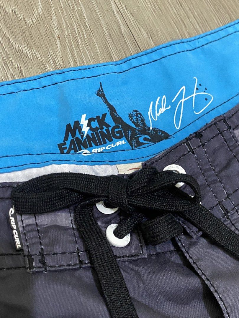 Rip Curl Mick Fanning Board Shorts Size 36 (Category: Swim Trunks & Board Shorts) located in Manila. Submitted by owabaet12 (Listing ID 1464057626, Image 3). Description: - Rip Curl board shorts - Size: 36 - Color: Grey gradient with white 'X' graphics - Collaboration: Mick Fanning - Features: Back pocket with velcro closure, drawstring waist - Ideal for: Swimming, surfing.