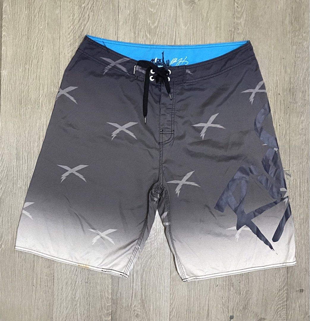 Rip Curl Mick Fanning Board Shorts Size 36 (Category: Swim Trunks & Board Shorts) located in Manila. Submitted by owabaet12 (Listing ID 1464057626, Image 1). Description: - Rip Curl board shorts - Size: 36 - Color: Grey gradient with white 'X' graphics - Collaboration: Mick Fanning - Features: Back pocket with velcro closure, drawstring waist - Ideal for: Swimming, surfing.