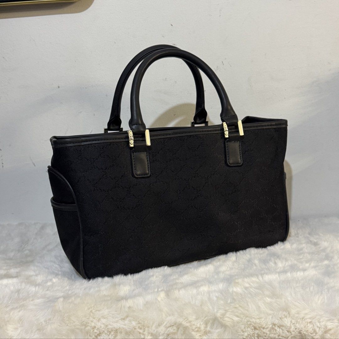Roberta di Camerino Black Monogram Canvas handbag (Category: Luxury Bags & Wallets) located in Rizal. Submitted by houseofbell (Listing ID 1464116930, Image 3). Description: - Authentic Roberta di Camerino tote bag - Signature monogram canvas with leather trim - Front flap pocket - Side pockets - Interior zip pocket and compartments Canvas and genuine leather handle Dimensions 13x7.5 inches .