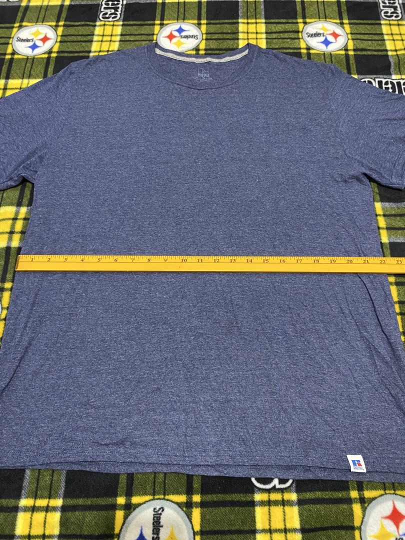 RUSSELL ATHLETIC, T-shirt (Category: Tshirts & Polo Shirts ) located in Cavite. Submitted by jc_thrift95 (Listing ID 1463983711, Image 3). Description: - a blue melange crewneck short-sleeve t-shirt with a small logo tag at the bottom hem, resembling a basic russell athletic blend tee. - Made in Ecuador - Color rate 8/10 - See pictures details for dimes..