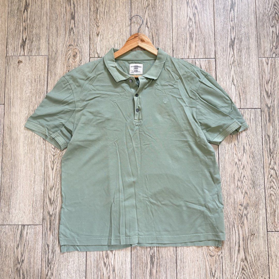 Sage Green Polo Shirt (Category: Tshirts & Polo Shirts ) located in Imus. Submitted by reloved.nd (Listing ID 1464074346, Image 1). Description: - Sage green KITH x Adidas polo shirt - Short sleeves with classic collar - Button placket - Small embroidered logo on chest - Comfortable cotton material - Ideal for casual wear or layering.