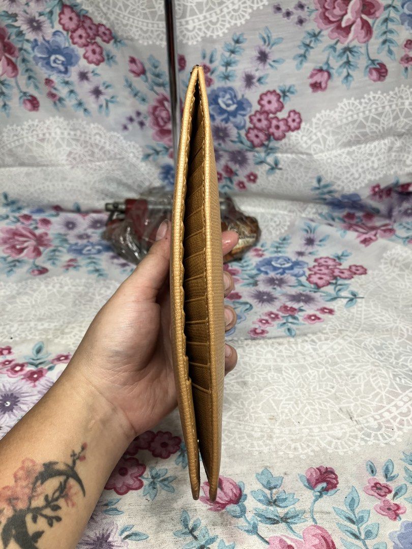 SAINT LAURENT LONG ZIP WALLET (Category: Wallets & Card holders) located in General Mariano Alvarez. Submitted by adonid (Listing ID 1463976716, Image 3). Description: ORIGINAL SAINT LAURENT LONG ZIP WALLET GOOD CONDITION NORMAL SIGN OF USAGE ONLY .