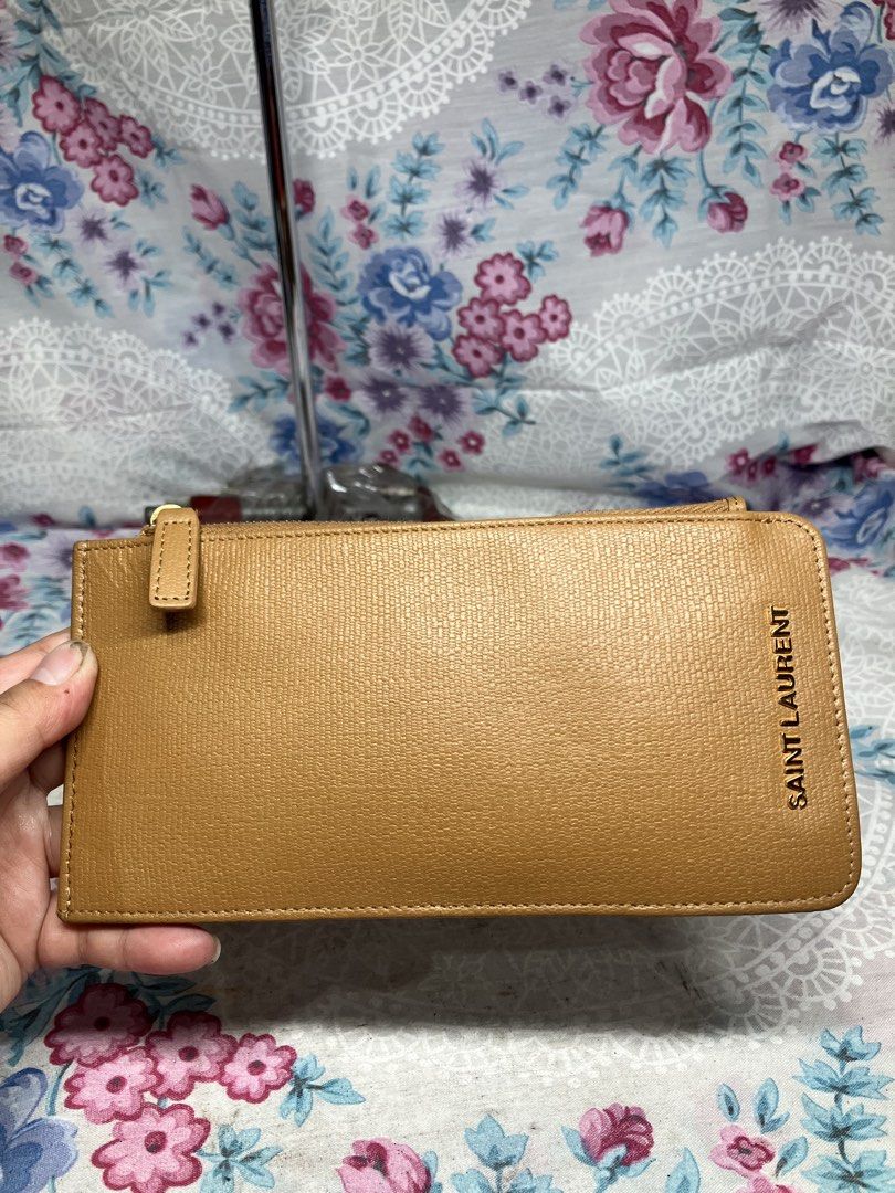 SAINT LAURENT LONG ZIP WALLET (Category: Wallets & Card holders) located in General Mariano Alvarez. Submitted by adonid (Listing ID 1463976716, Image 1). Description: ORIGINAL SAINT LAURENT LONG ZIP WALLET GOOD CONDITION NORMAL SIGN OF USAGE ONLY .