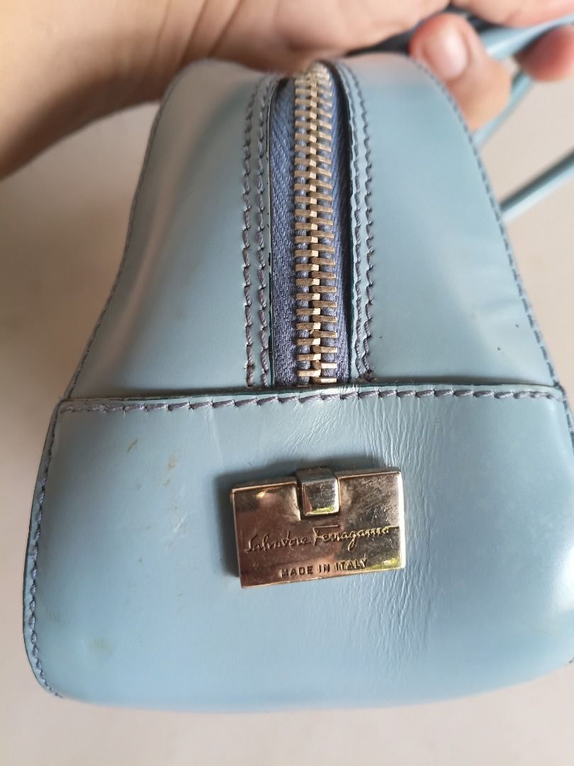 Salvatore Ferragamo Gancini Monogram Shoulder Bag (Category: Luxury Bags & Wallets) located in Caloocan City. Submitted by harrypotter0215 (Listing ID 1463982598, Image 2). Description: - Authentic Light Blue Salvatore Ferragamo Shoulder Bag - Features iconic Gancini monogram pattern - Genuine leather trim and handles - Secure zipper closure - Made in Italy - Classic, timeless design - Shows minor signs of wear on leather, consistent with age and