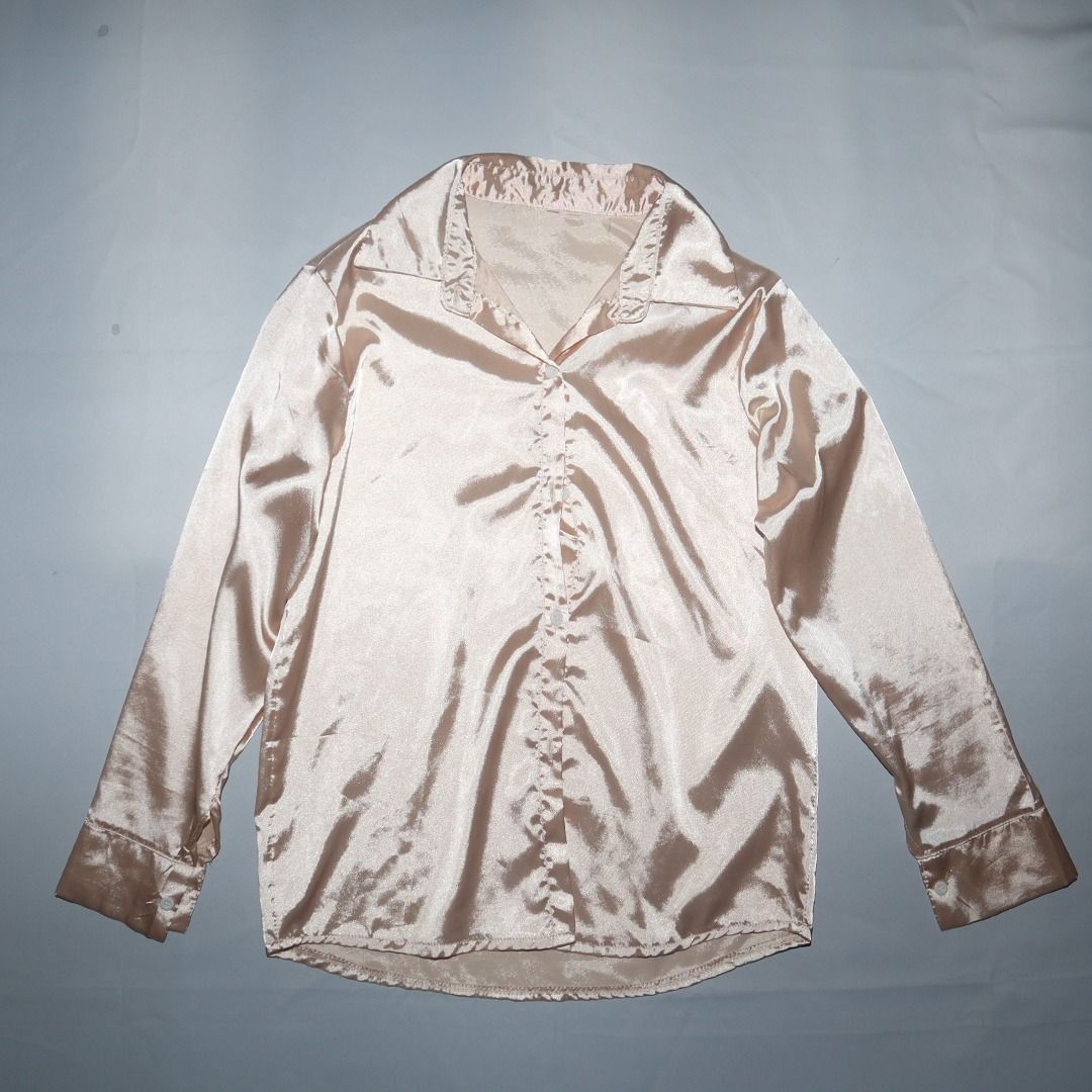 Satin Button-Up Shirt (Category: Blouses) located in Tanauan. Submitted by arlene_panganiban (Listing ID 1463990258, Image 2). Description: - Lightweight satin fabric - Classic button-up style - Long sleeves with button cuffs - Elegant champagne/beige color - Perfect for dressing up or down.