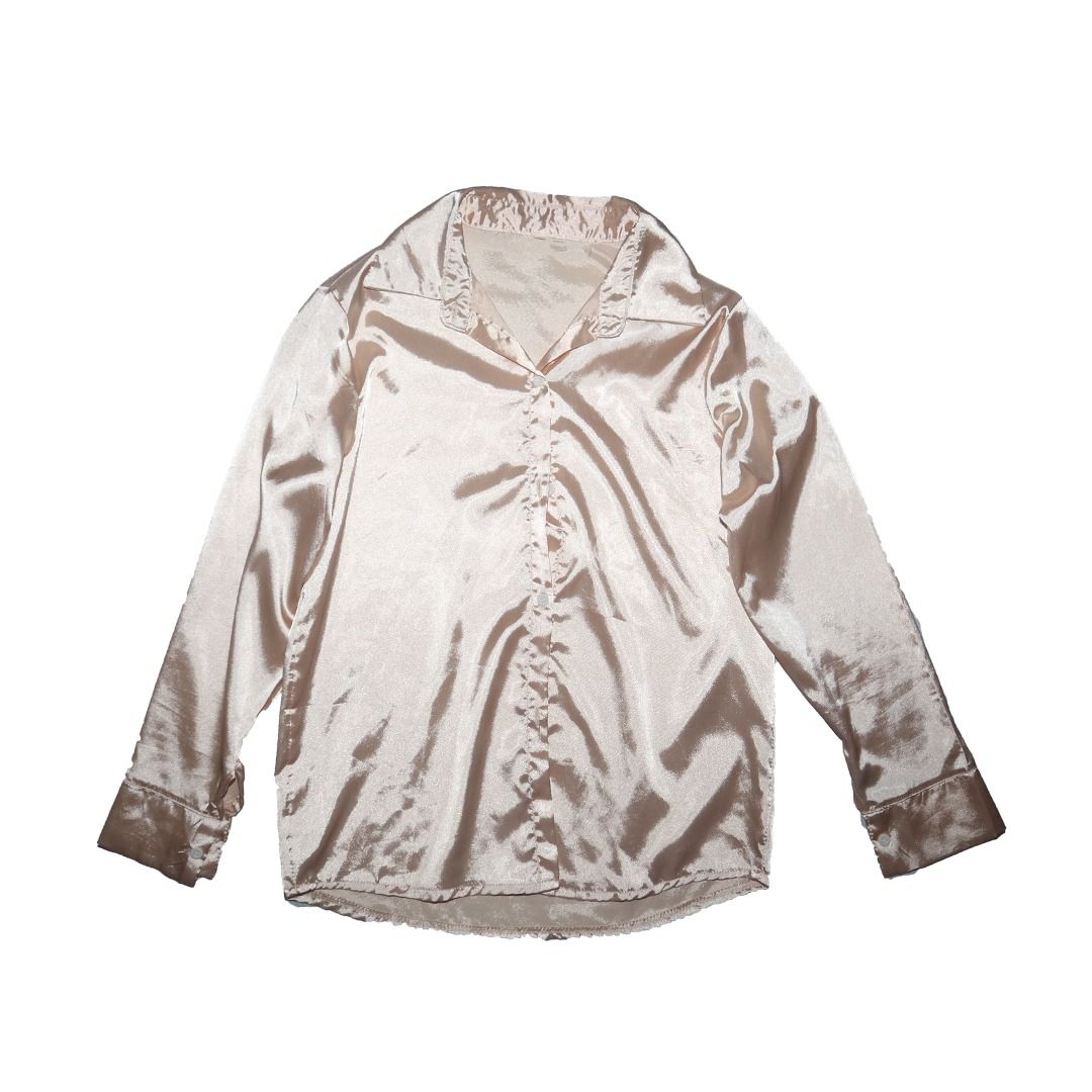 Satin Button-Up Shirt (Category: Blouses) located in Tanauan. Submitted by arlene_panganiban (Listing ID 1463990258, Image 1). Description: - Lightweight satin fabric - Classic button-up style - Long sleeves with button cuffs - Elegant champagne/beige color - Perfect for dressing up or down.