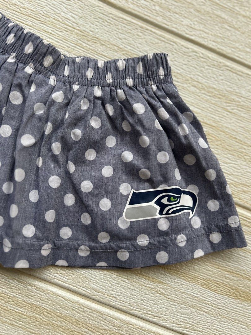 Seahawks Polka skirt (Category: Babies & Kids Fashion) located in Cebu City. Submitted by yjainani (Listing ID 1464029692, Image 2). Description: grey polka dot baby girl skirt featuring the Seattle Seahawks team logo near the hem.