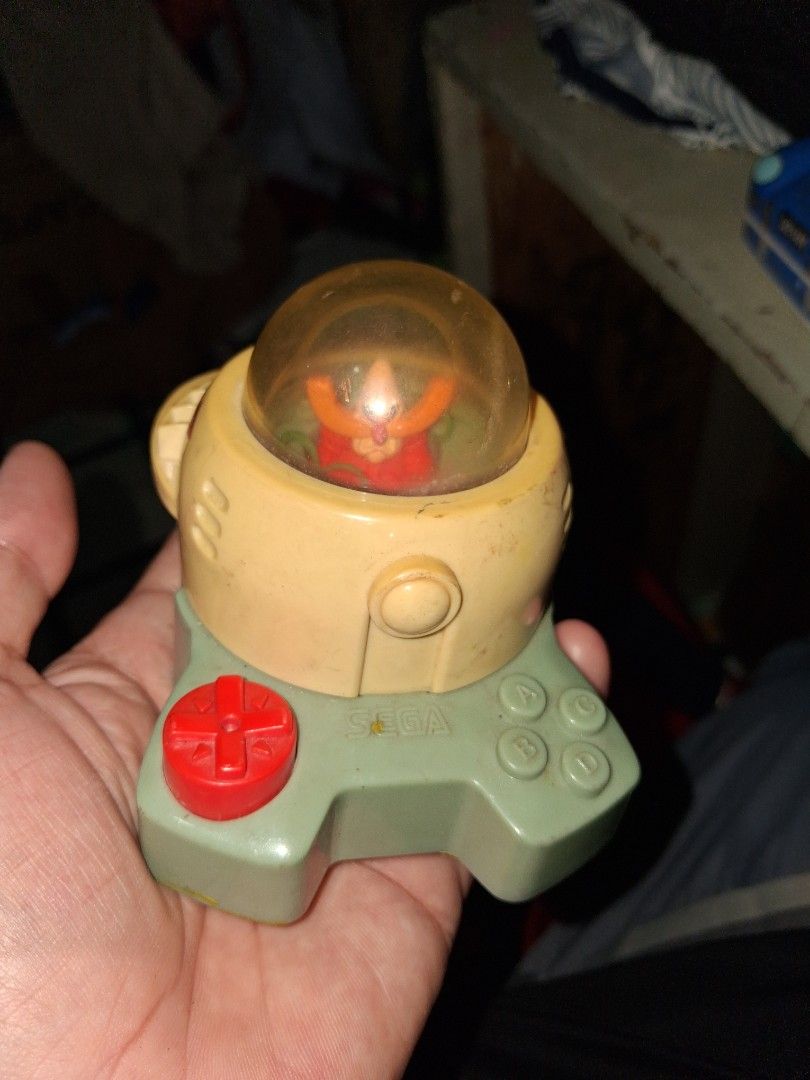 Sega Burger King sonic r.robotnic 1998 (Category: Vintage Collectibles) located in Manila. Submitted by marcas022798212 (Listing ID 1464047042, Image 1). Description: - Vintage Sega toy from Burger King Kids Club - Features Sonic the Hedgehog inside a clear dome - Plastic shows some yellowing and marks - Dried yellow residue on the bottom (possible packaging/condiment stain) - Fun collectible for Sonic fans and 90s fast food toy enthusiasts.