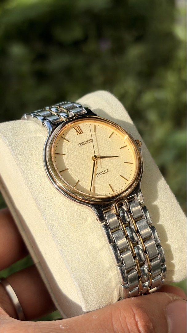 Seiko Dolce Two-Tone Watch (Category: Women's Watches) located in Merida. Submitted by opustimepieces2026 (Listing ID 1464055796, Image 2). Description: - Classic Seiko Dolce watch - Cream dial with Roman numerals - Two-tone stainless steel band with gold accents - Simple and elegant design - Suitable for everyday wear or special occasions - In good working condition.