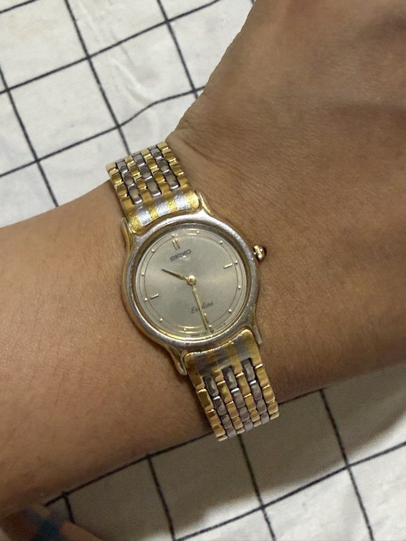 Seiko Exceline Two-Tone Watch (Category: Women's Watches) located in Manila. Submitted by wanderiri (Listing ID 1464063462, Image 1). Description: - Seiko Excelia Two-Tone Watch - Gold and Silver Accents - Light Silver Watch Face - Classic Link Band Style - Timeless and Versatile Design - Ideal for Everyday or Dressy Occasions.