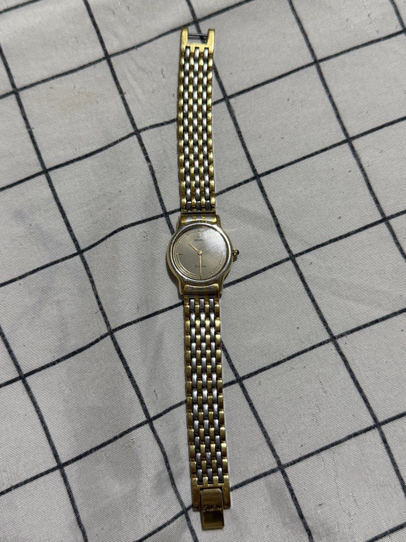 Seiko Exceline Two-Tone Watch (Category: Women's Watches) located in Manila. Submitted by wanderiri (Listing ID 1464063462, Image 3). Description: - Seiko Excelia Two-Tone Watch - Gold and Silver Accents - Light Silver Watch Face - Classic Link Band Style - Timeless and Versatile Design - Ideal for Everyday or Dressy Occasions.