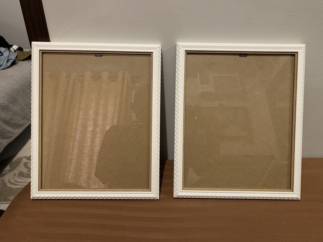 Set of 2 White Decorative Picture Frames (Category: Frames & Pictures) located in Paranaque City. Submitted by zyyee (Listing ID 1463947541, Image 1). Description: - Set of 2 white picture frames - Features a nice decorative edge - Can be displayed on a tabletop using the stand or hung on a wall - Ideal for showcasing photos or artwork - Selling as a pair.