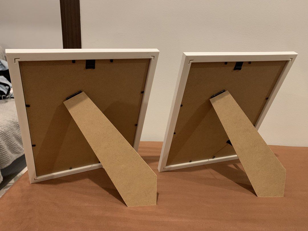 Set of 2 White Decorative Picture Frames (Category: Frames & Pictures) located in Paranaque City. Submitted by zyyee (Listing ID 1463947541, Image 3). Description: - Set of 2 white picture frames - Features a nice decorative edge - Can be displayed on a tabletop using the stand or hung on a wall - Ideal for showcasing photos or artwork - Selling as a pair.