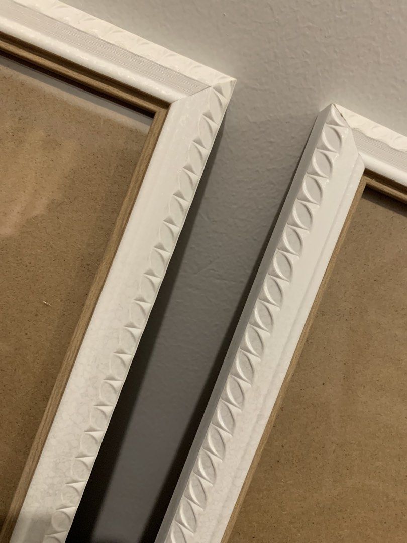 Set of 2 White Decorative Picture Frames (Category: Frames & Pictures) located in Paranaque City. Submitted by zyyee (Listing ID 1463947541, Image 2). Description: - Set of 2 white picture frames - Features a nice decorative edge - Can be displayed on a tabletop using the stand or hung on a wall - Ideal for showcasing photos or artwork - Selling as a pair.
