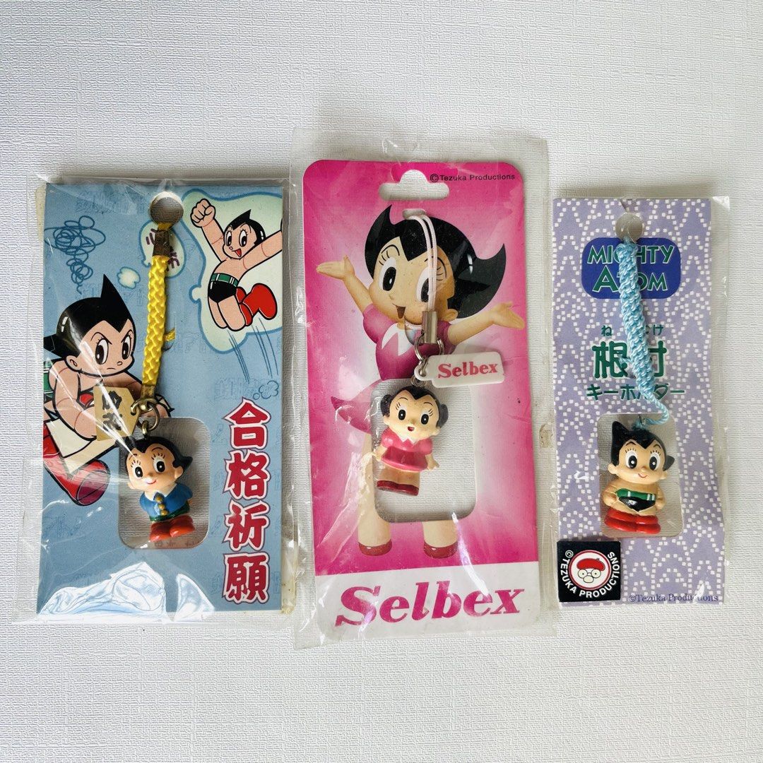 Set of 3 Astro Boy / Mighty Atom Keychains (Category: Character Goods) located in Cabuyao City. Submitted by nyannyancore (Listing ID 1463965549, Image 1). Description: - Set of 3 Astro Boy keychains - Includes Selbex Atom & Uran keychain - Features a 'Gokaku Kigan' good luck charm keychain - Also includes a Mighty Atom keychain - All items are in their original packaging - Ideal for Astro Boy collectors and fans.