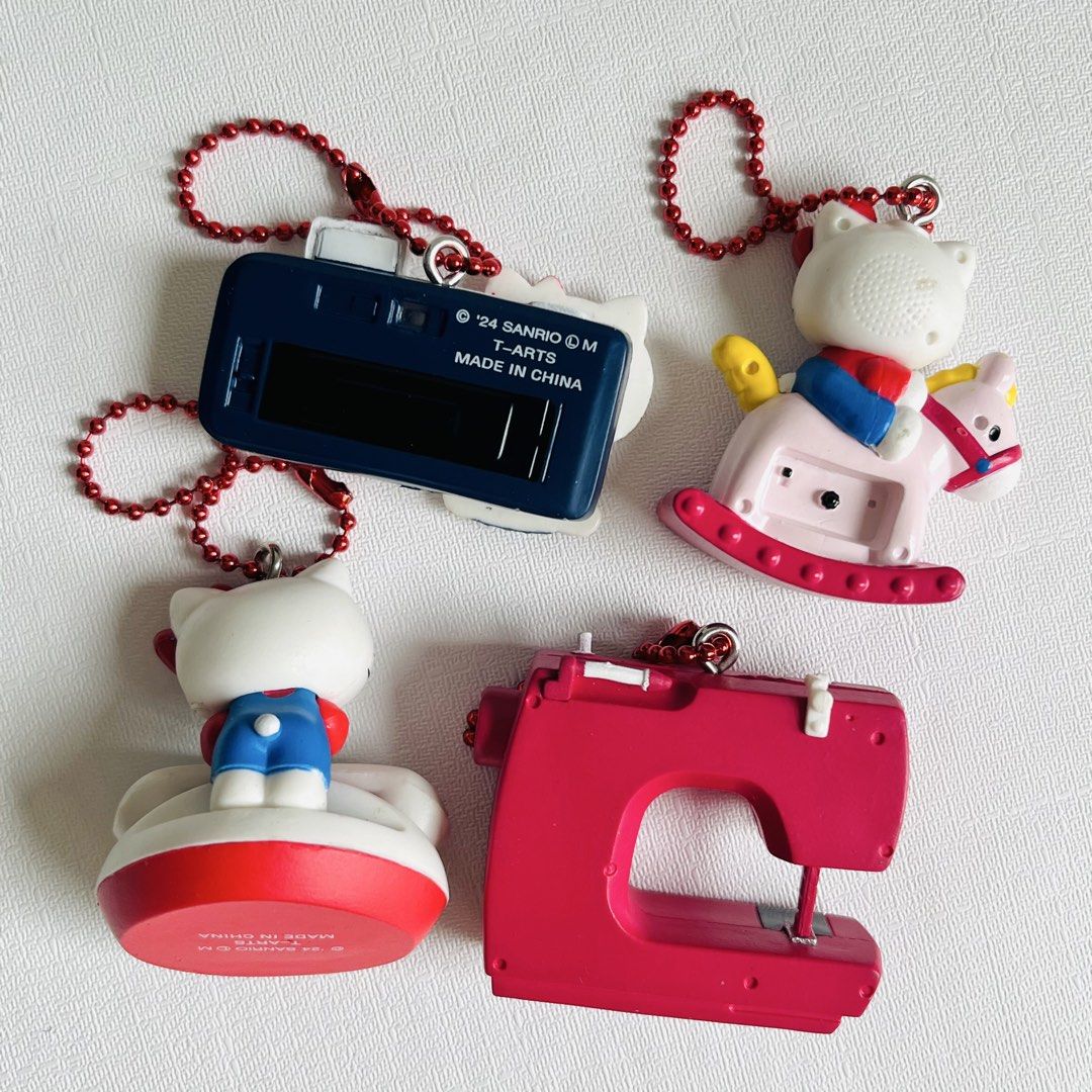 Set of 4 Hello Kitty Miniatures Keychain (Category: Charms) located in Cabuyao City. Submitted by nyannyancore (Listing ID 1463966128, Image 2). Description: - Set of 4 adorable Kitty charms - Includes: camera, telephone, rocking horse with clock, sewing machine - Each charm features a red ball chain attached - Ideal for Kitty collectors or as cute bag charms - Made in China.