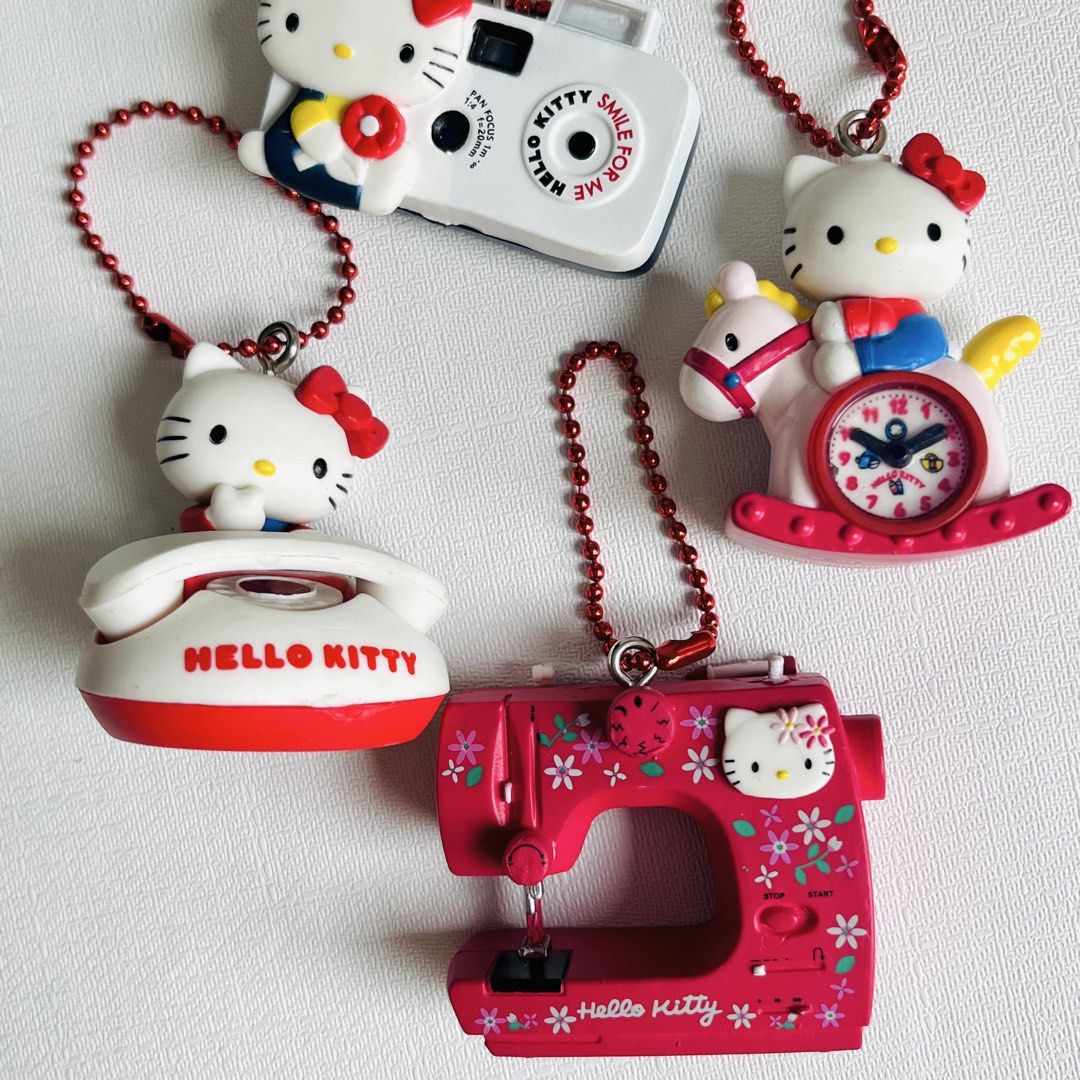 Set of 4 Hello Kitty Miniatures Keychain (Category: Charms) located in Cabuyao City. Submitted by nyannyancore (Listing ID 1463966128, Image 3). Description: - Set of 4 adorable Kitty charms - Includes: camera, telephone, rocking horse with clock, sewing machine - Each charm features a red ball chain attached - Ideal for Kitty collectors or as cute bag charms - Made in China.