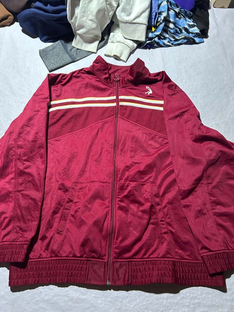 Shaq Track Jacket Red XL Polyester (Category: Coats, Jackets and Outerwear) located in Quezon City. Submitted by jeyem. (Listing ID 1463967880, Image 1). Description: - Red Shaq Track Jacket - Made of 100% Polyester - Features two white and yellow stripes across the chest - Mesh paneling on the upper chest area - Zipper closure - Elasticated cuffs and hem - Two front pockets - Ideal for sports or casual wear.