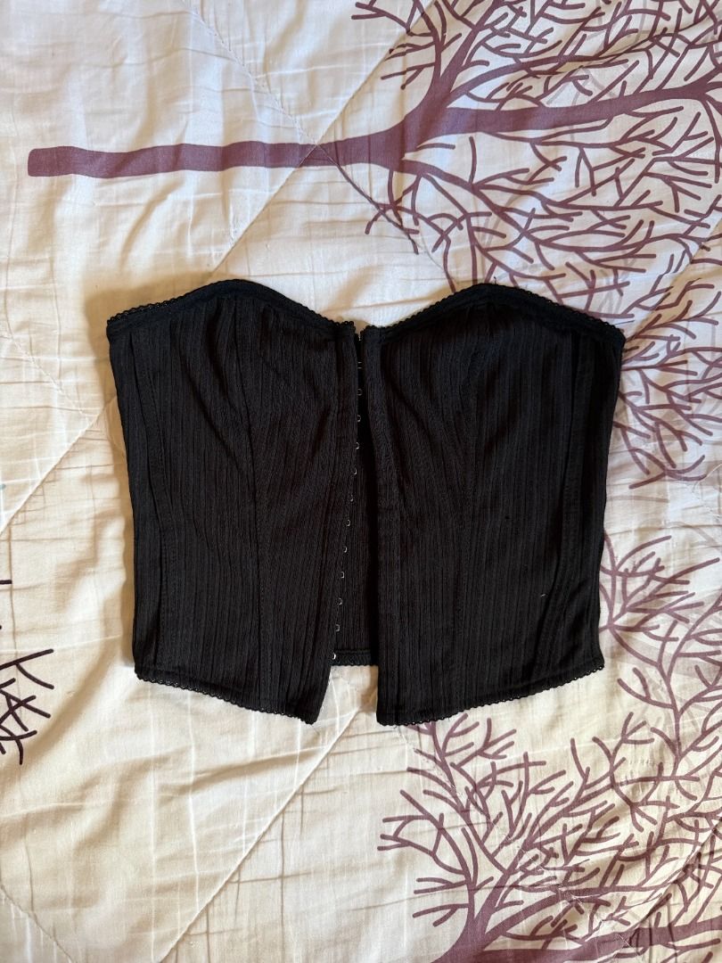 SHEIN Black Corset Top with Hook and Eye Closure (Category: Sleeveless) located in Manila. Submitted by dndclothing (Listing ID 1463972212, Image 2). Description: ⊹ SHEIN black ribbed corset top ⊹ front hook and eye closure ⊹ size S on tag but im usually an M wc makes it more fitted ⊹ used to be my fave going out top lol.