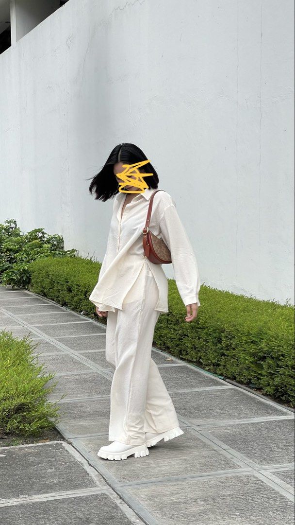 Shein Coords Blouse & Pants (Category: Sets or Coordinates) located in Orani. Submitted by iveecrz (Listing ID 1463992721, Image 1). Description: Fits S-L Cream two-piece set Long sleeve button-up shirt with side slits Matching wide-leg pants.