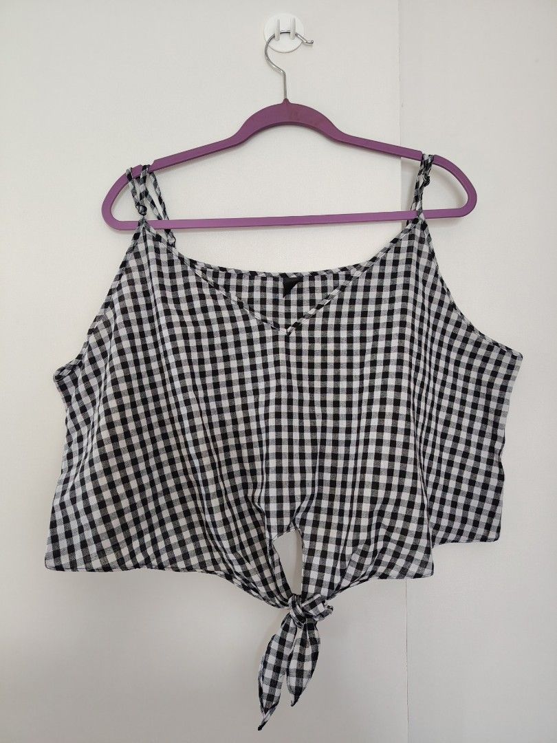 SHEIN Curve Gingham Tie-Front Cami Top (Category: Sleeveless) located in Manila. Submitted by wisepenguin.89f414 (Listing ID 1463966034, Image 1). Description: - Cute black and white gingham cami top - Features a tie-front detail at the hem - Adjustable spaghetti straps - Great for casual wear or layering - Easy to style with jeans or shorts - Lightweight fabric.