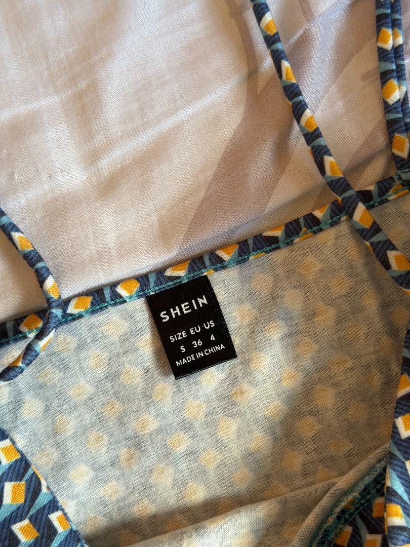 SHEIN Geometric Print Spaghetti Strap Crop Top (Category: Sleeveless) located in Manila. Submitted by dndclothing (Listing ID 1463973480, Image 2). Description: ⊹ tank w geometric pattern in blue yellow and white ⊹ thin spaghetti straps ⊹ size S on tag w light stretch fabric.