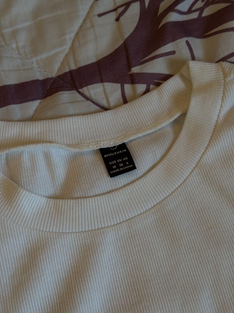SHEIN White Ribbed Cropped T-Shirt (Category: Shirts) located in Manila. Submitted by dndclothing (Listing ID 1463979489, Image 2). Description: ⊹ SHEIN white ribbed cropped t-shirt ⊹ size M, cropped, stretchy ⊹ basic, easy to pair with anything.