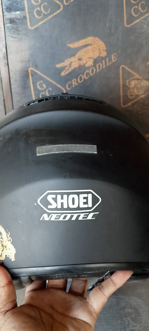 Shoei Neotec Motorcycle Helmet with Sun Visor (Category: Caps & Hats) located in Quezon City. Submitted by jpnvintageonline (Listing ID 1463976984, Image 3). Description: - Shoei Neotec Helmet - Matte Black Finish - Built-in Flip-Down Sun Visor - Adjustable Chin Strap - Minor Exterior Scuffs Present - Clear Visor - interior foam cosmetic issue .
