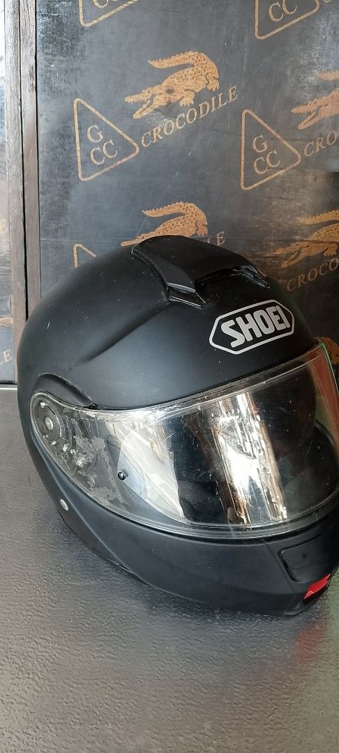 Shoei Neotec Motorcycle Helmet with Sun Visor (Category: Caps & Hats) located in Quezon City. Submitted by jpnvintageonline (Listing ID 1463976984, Image 2). Description: - Shoei Neotec Helmet - Matte Black Finish - Built-in Flip-Down Sun Visor - Adjustable Chin Strap - Minor Exterior Scuffs Present - Clear Visor - interior foam cosmetic issue .