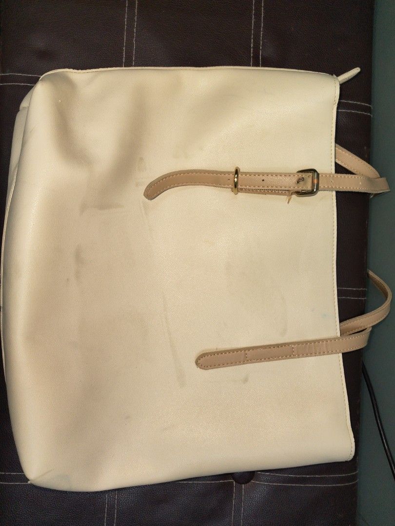 SIMPLE & BEAUTY Cream Tote Bag (Category: Tote Bags) located in Paranaque City. Submitted by joycelyn10 (Listing ID 1463952705, Image 2). Description: - Cream colored tote bag from SIMPLE & BEAUTY - Features two tan straps - Plenty of life left, perfect for everyday use - Visible stain see on the picture.