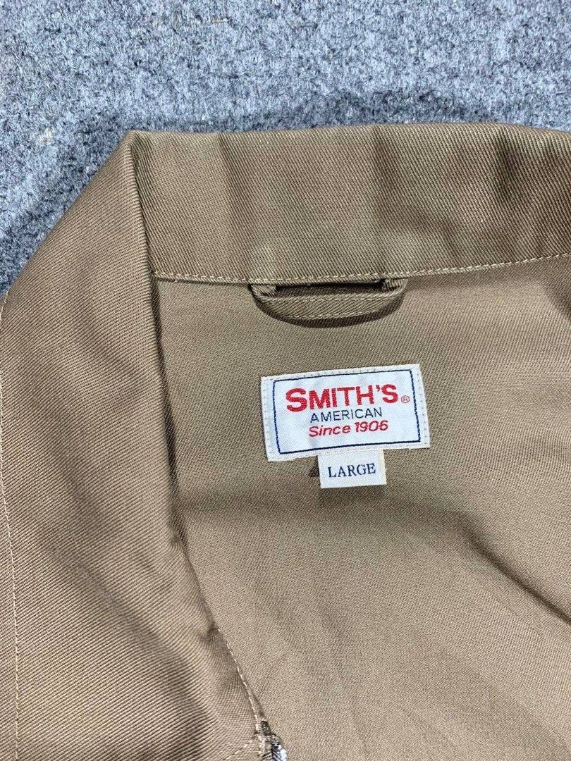 Smith's American (Category: Coats, Jackets and Outerwear) located in Zamboanga. Submitted by zhifay (Listing ID 1464102431, Image 2). Description: Smith's American Since 1906 Zipper Workwear Jacket Features beige/khaki cotton twill construction, full front zip closure, dual side pockets, adjustable button cuffs, and the signature red logo chest patch. Measurement (inches): Tag Size: Large Pit to Pit: 22.5" Length: 27" Condition: 9.5/10 Excellent 
