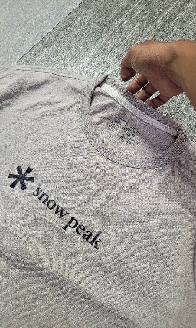 SNOW PEAK LOGO TEE (Category: Tshirts & Polo Shirts ) located in Manila. Submitted by 7100treasure.co (Listing ID 1463974004, Image 2). Description: SNOW PEAK LOGO TEE • Screenprinted Snow Peak asterisk logo and wordmark across the chest • Printed neck tag for tagless comfort • Classic crewneck silhouette • Width: 22" • Length: 28" • Condition: Pre-loved condition ​📍 Location: Dipolog City, Zamboanga del Norte 🚛 J&T Courier 💸 MOP: GCash / Bank