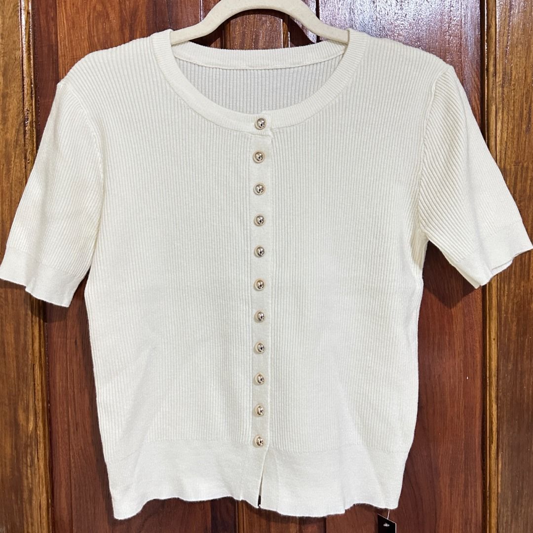 BKK Soft Knitted Button-Front Cardigan Top (Category: Blouses) located in Lucena. Submitted by the.hidden.closet (Listing ID 1463981522, Image 3). Description: DECLUTTERING SALE ✨ • Soft knitted fabric — not see-through • Cool and comfortable on the skin • Functional button-front closure • Can be worn as a cardigan or buttoned up as a top • Size: One Size • Dimensions (laid flat): 20” L × 15” W • Fits up to approximately 40” bust • Stretchable an