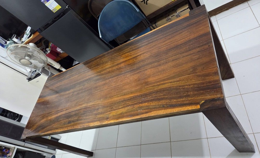 Solid Wood Dining Table (Category: Tables & Sets) located in Manila. Submitted by brendamoreno (Listing ID 1463984506, Image 1). Description: - Solid wood dining table - Beautiful, rich grain with warm tones - Sturdy and versatile (dining or workspace) - Dimensions: Approx. 120cm (L) x 60cm (W) x 75cm (H) - Shows some signs of use, consistent with age - Ready for a new home Slightly negotiable PM if interested .