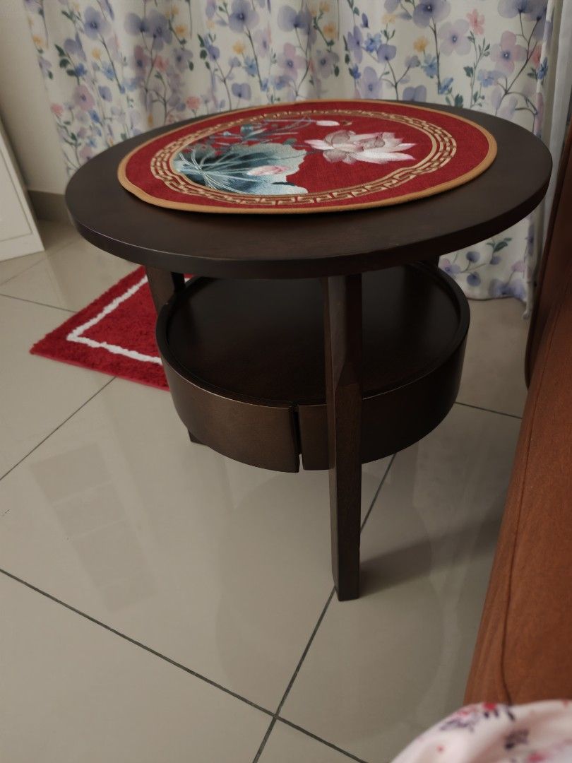 Solid Wood Round Side Table (Category: Tables & Sets) located in Nusajaya. Submitted by sanchella73 (Listing ID 1464112373, Image 2). Description: - Dark wood round side table - Features a lower shelf for extra storage - Perfect for living rooms or bedrooms.