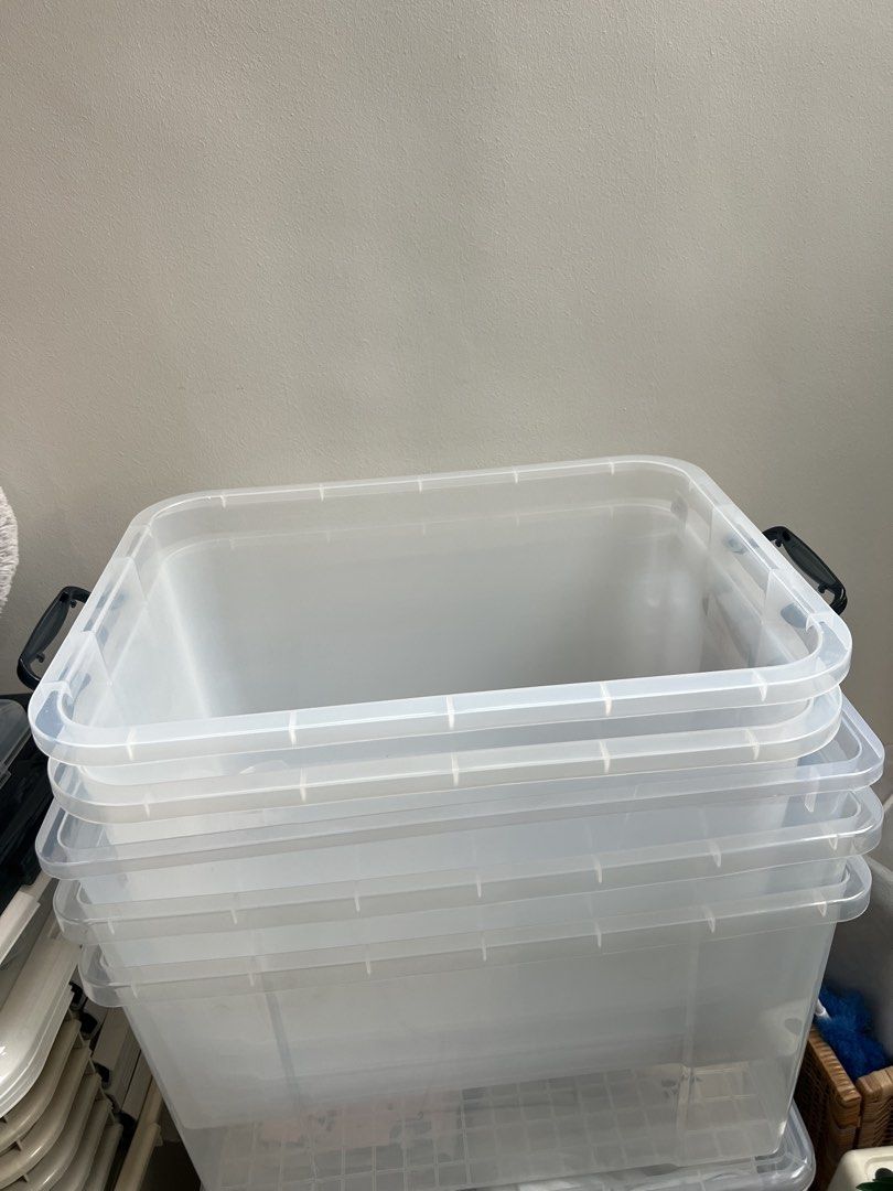 Stackable Clear Storage Boxes with Lids (Category: Storage Boxes & Baskets) located in Singapore. Submitted by origination (Listing ID 1464033653, Image 2). Description: - $50 for ALL 12 storage boxes - only used once for moving house - Set of clear storage boxes with lids - Stackable design for efficient storage - Includes various sizes - Lid colors: some dark grey, some clear - Largest box is light beige - Ideal for organizing home or garage sp