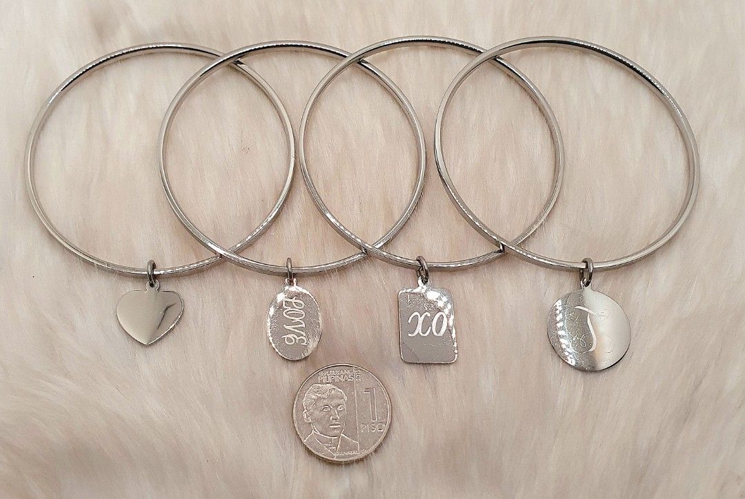 Stainless Steel Bangles with Charms (Category: Bracelets) located in San Juan City. Submitted by loulous_boutique_manila (Listing ID 1464047977, Image 2). Description: 🌸 Stainless steel bangles with charms 🌸 Diameter of Bangle: 2 ½ inches 🌸 SOLD INDIVIDUALLY 🌸 🌸 Non-tarnish 🌸 Not magnetic - Pls DM me for further inquiries - BUNDLE DISCOUNTS ARE AVAILABLE FOR PURCHASES OF 2 OR MORE ITEMS 🪙 PAYMENT IS THROUGH GCASH 🪙 - SHIPPING FEE TO BE SH