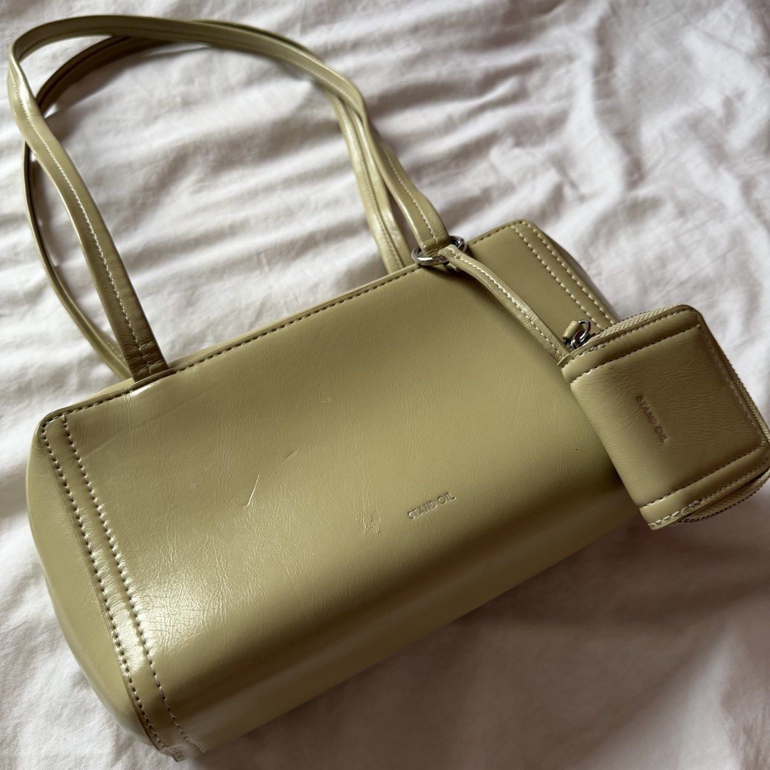 STAND OIL Post Bag in Sand (Category: Luxury Bags & Wallets) located in Mabalacat. Submitted by pauwieee12 (Listing ID 1463959606, Image 2). Description: - STAND OIL Post Bag in Sand color - brand new price ₱6,100 - Chic shoulder bag style - Comes with a small detachable pouch - Ideal for everyday use - Minimal signs of wear, still looks great.