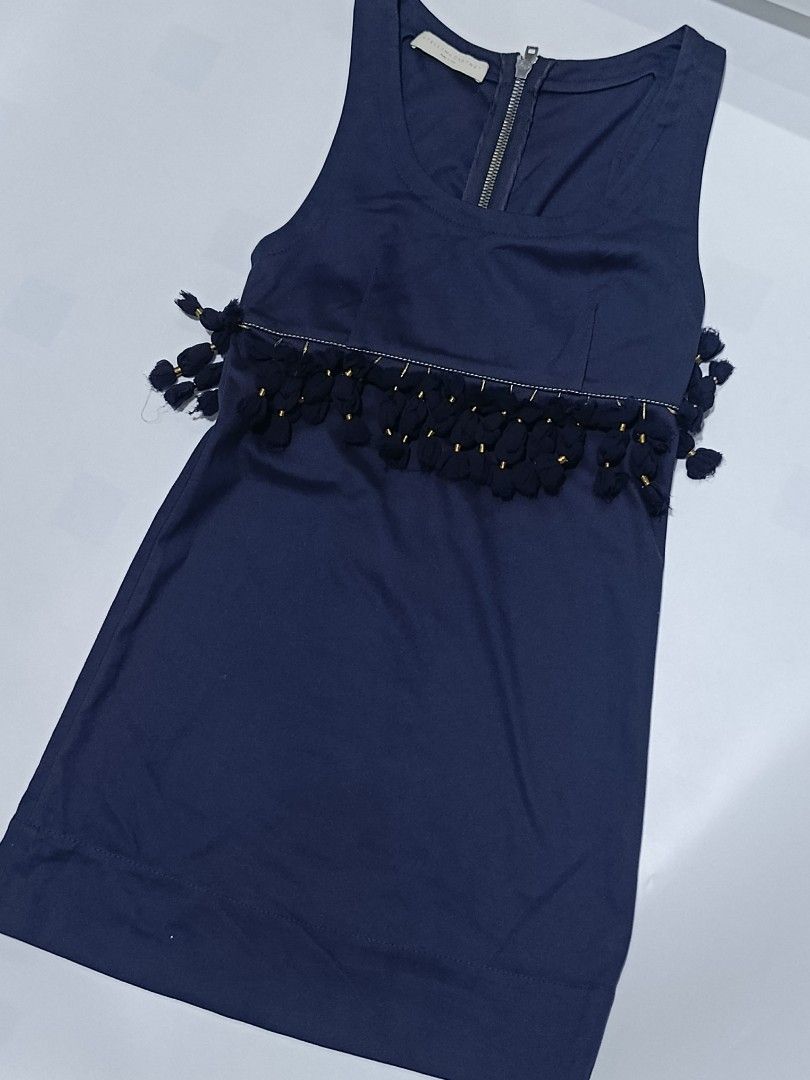 Stella McCartney Sleeveless dress (Category: Dresses) located in Tacloban City. Submitted by agnescthrifted98 (Listing ID 1464075137, Image 1). Description: Stella McCartney sleeveless dress features a stylish waistline accented with matching tassels and delicate gold bead details. no issue Excellent Condition size 36 14inchesx 32.