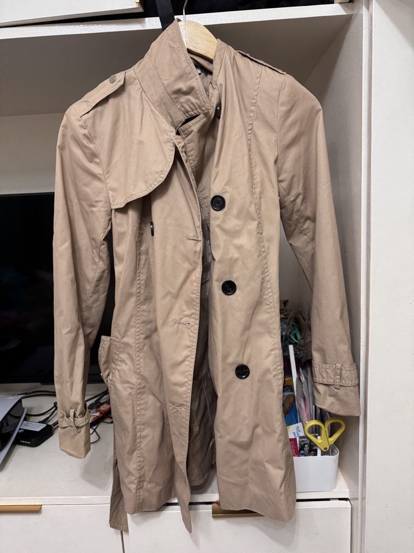 Stradivarius Beige Classic Trench Coat Size M (Category: Coats, Jackets and Outerwear) located in Paranaque City. Submitted by kgsantos (Listing ID 1463943661, Image 1). Description: - Classic beige trench coat from Stradivarius - Double-breasted with button closure - Includes a belt to cinch the waist - Ideal for layering over any outfit - Perfect for transitional weather - Size: Medium (M) - Condition: Good.