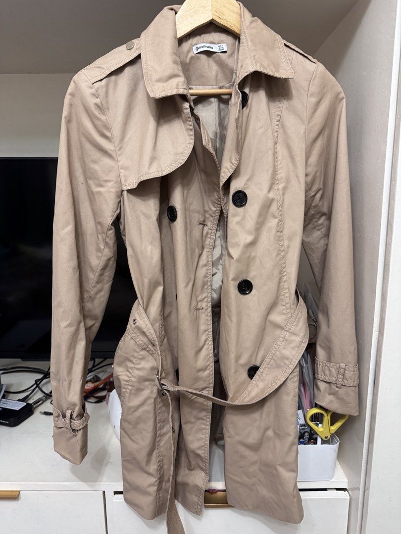 Stradivarius Beige Classic Trench Coat Size M (Category: Coats, Jackets and Outerwear) located in Paranaque City. Submitted by kgsantos (Listing ID 1463943661, Image 3). Description: - Classic beige trench coat from Stradivarius - Double-breasted with button closure - Includes a belt to cinch the waist - Ideal for layering over any outfit - Perfect for transitional weather - Size: Medium (M) - Condition: Good.