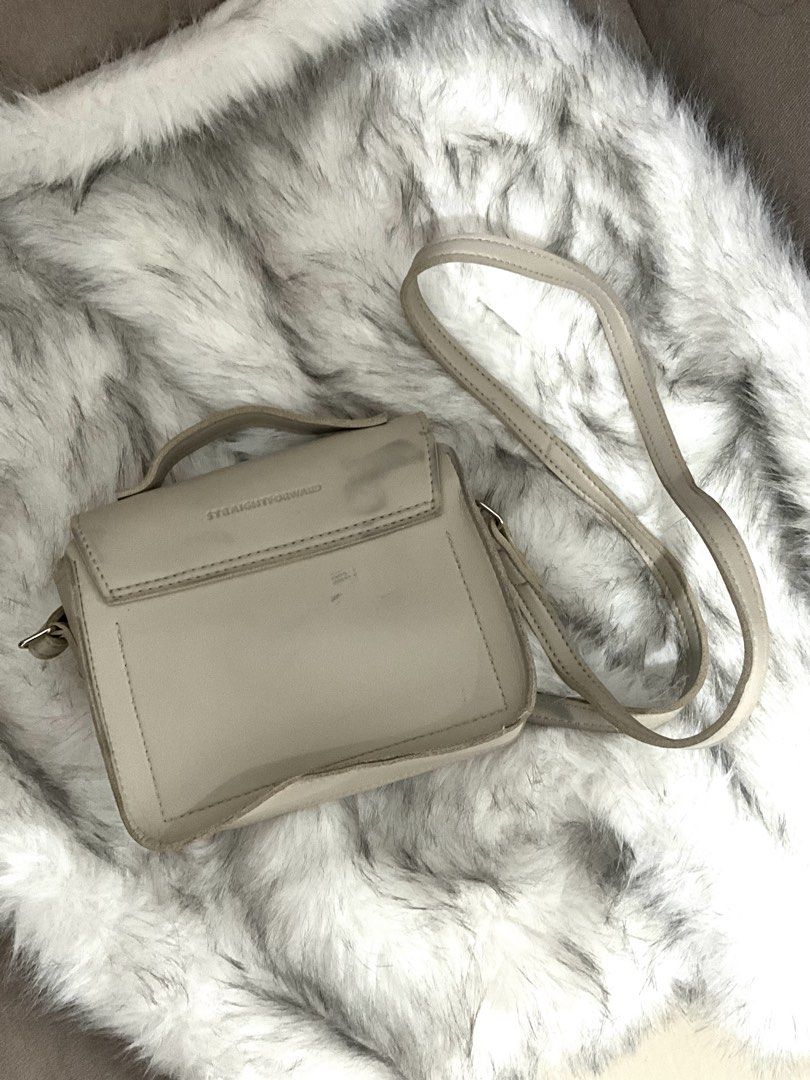 Straightforward Crossbody Bag with Buckle (Category: Cross-body Bags) located in Manila. Submitted by francine.edit (Listing ID 1464017908, Image 2). Description: Description: Selling my pre-loved Straightforward satchel crossbody bag in cream/beige. Classic structured design that fits daily essentials comfortably! Brand: Straightforward Color: Cream / Light Beige Condition: Pre-loved. Clean front, interior, and working zipper/hardware. The back 