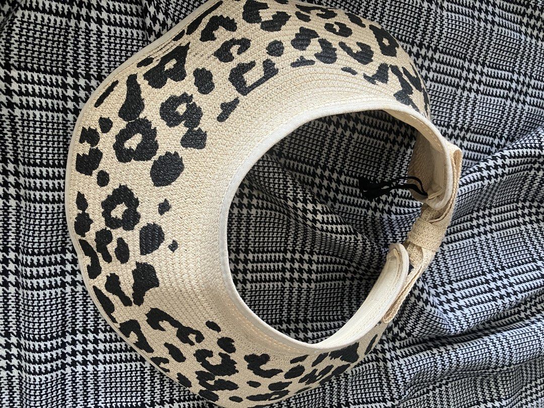 Straw hat sun visor (Category: Hats & Beanies) located in Angeles City. Submitted by jnwsurplus (Listing ID 1463977125, Image 1). Description: beige braided straw sun visor featuring a black leopard print pattern and an adjustable velcro closure.
