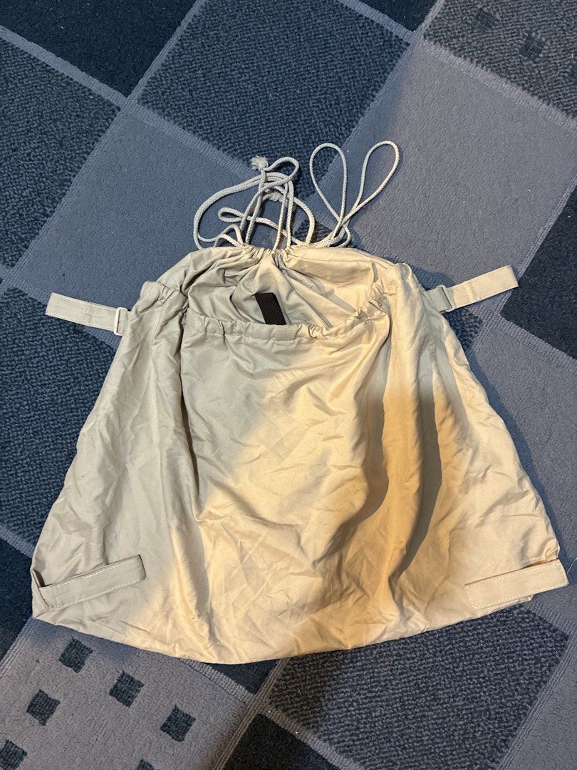 Stroller Organizer Bag (Category: Other Babies Going Out Needs) located in Lapu Lapu. Submitted by curated.buys (Listing ID 1464077925, Image 2). Description: - Beige drawstring bag - Two side straps - Secure drawstring closure - Durable, lightweight synthetic material (nylon-like) - Compact and foldable for easy storage.